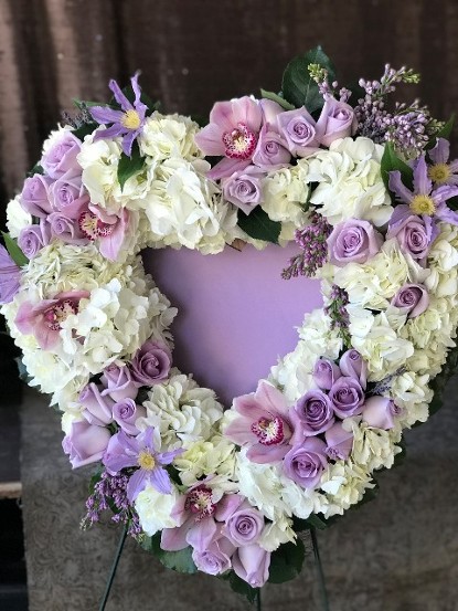 purple flowers shaped in to a heart 