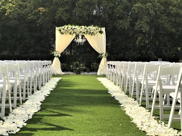 wedding ceremony fabric and flower arch with chandelier, aisle petals, hyatt valencia hotel rose garden