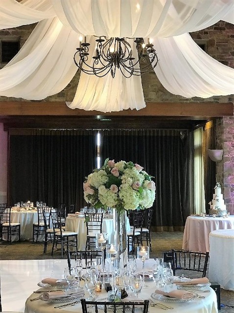 Oaks Grill Wedding Reception in Valencia California, Tall Flower Centerpiece and Fabric Draping by Claires Flowers