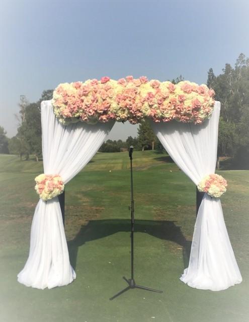 Custom Wedding Arch, white fabric draping, with flowers 