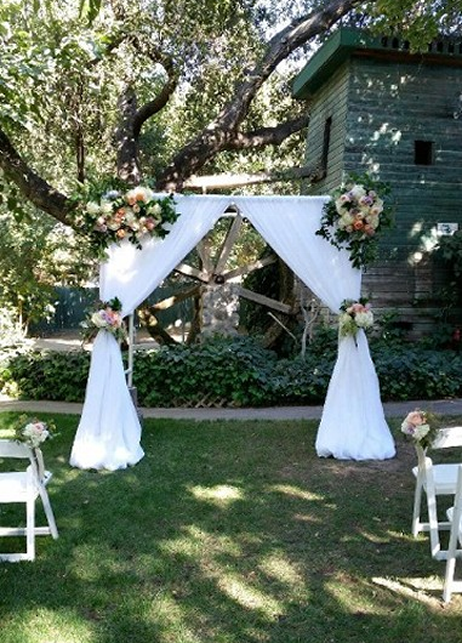 Le Chene Wedding Ceremony Arch Decor with Fabric and Flowers