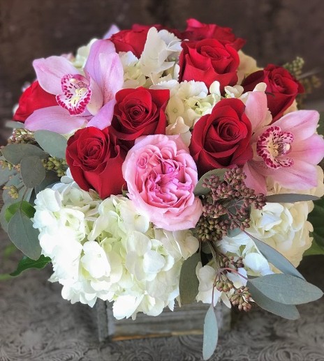 Claires Flowers valentines day flower arrangement filled with red roses, pink garden roses and white hydrangea