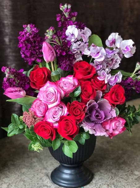 Purple and Red flowers arranged with high style 