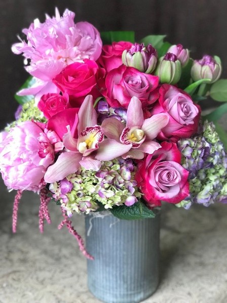 Pink and Purple Flower Arrangement arranged in a metal cylinder vase. 