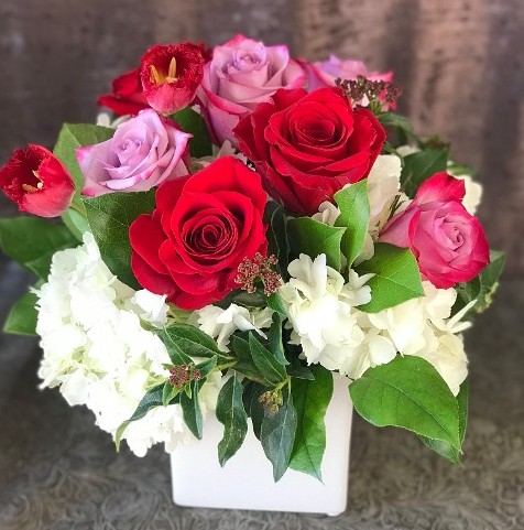 Mix of roses in small square vase